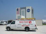 Space Coast Electric van in front of Kennedy Space Center Vehicle Assembly Building (VAB), Cape Canaveral, Florida
